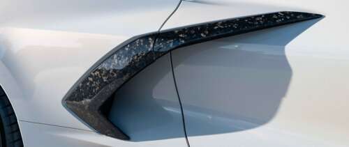 A sleek and powerful Chevrolet Corvette C8 sports car showcasing its aerodynamic... UWUHD free background images