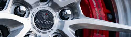 A sleek and powerful Chevrolet Corvette C8 sports car with modern aerodynamic lines. Dual UHD background images hd