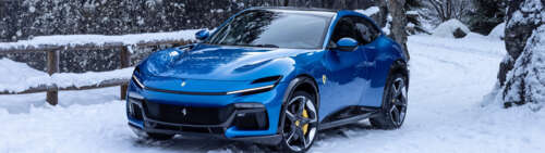 A sleek and vibrant blue Ferrari Purosangue luxury super SUV. Dual UHD free wallpaper for computer