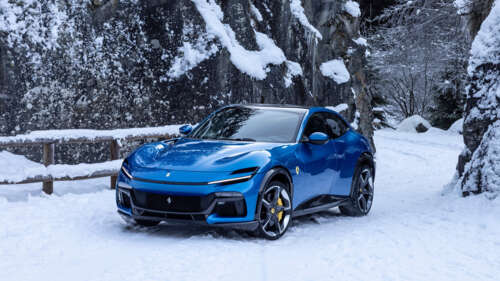 A sleek and vibrant blue Ferrari Purosangue luxury super SUV. 8K computer backgrounds