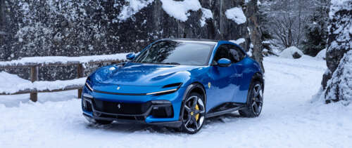 A sleek and vibrant blue Ferrari Purosangue luxury super SUV. UWUHD free hd wallpapers