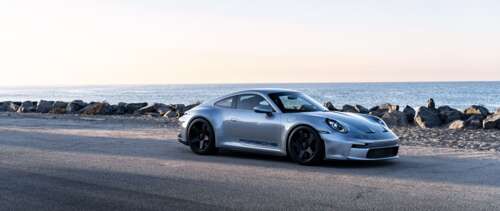 A high-resolution close-up of a Porsche GT3 RS sports car. UWUHD pictures for wallpaper
