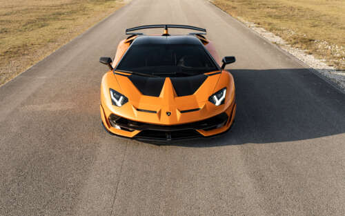 A close-up view of a Lamborghini Aventador SVJ, featuring its sleek aerodynamic bodywork... 7680x4800 wallpaper images