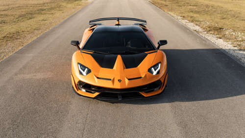 A close-up view of a Lamborghini Aventador SVJ, featuring its sleek aerodynamic bodywork... 8K wallpaper for laptop download