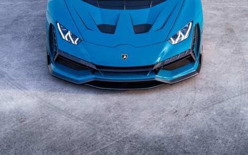 A high-performance Lamborghini Huracan Evo supercar showcasing its aerodynamic design... 7680x4800 wallpaper download