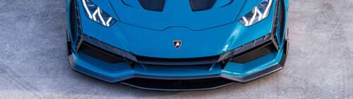 A high-performance Lamborghini Huracan Evo supercar showcasing its aerodynamic design... Dual UHD pictures for wallpaper
