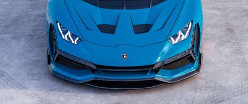 A high-performance Lamborghini Huracan Evo supercar showcasing its aerodynamic design... UWUHD wallpaper for pc download