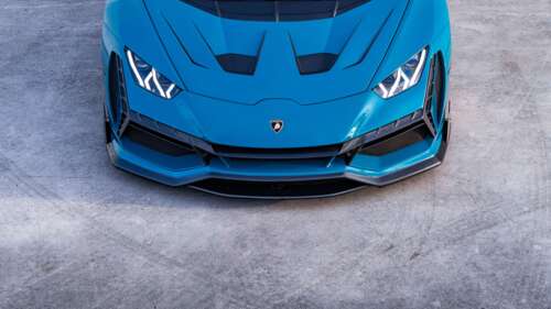 A high-performance Lamborghini Huracan Evo supercar showcasing its aerodynamic design... 4K (Ultra HD) hd background