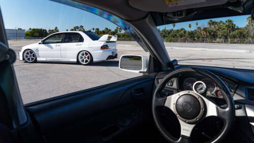 A detailed view of a Mitsubishi Lancer Evolution IX sports car. 4K (Ultra HD) high definition wallpaper