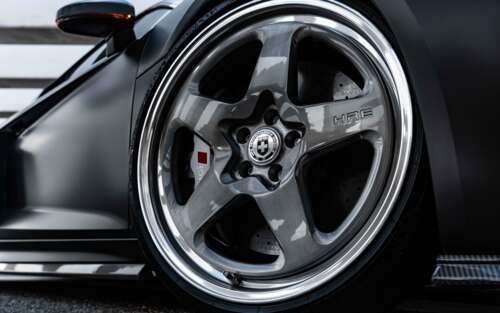 A professional close-up shot of a sleek Audi luxury sedan featuring a polished metallic... 7680x4800 desktop wallpaper