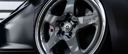 A professional close-up shot of a sleek Audi luxury sedan featuring a polished metallic... UWUHD wallpaper download