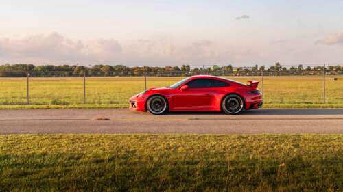 A detailed view of a sleek and powerful Porsche 992 GTS sports car showcasing its... 8K free background images