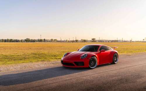 A sleek Porsche 992 GTS sports car featuring a polished exterior and iconic design. 7680x4800 background images hd