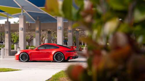 A sleek and modern Porsche 992 GTS sports car featuring aerodynamic design and aggressive... 8K pictures for wallpaper