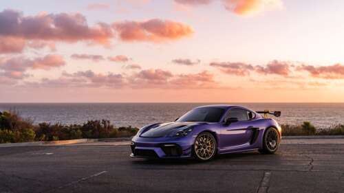 A sleek and powerful Porsche GT3 RS sports car featuring aggressive aerodynamic bodywork. 8K desktop wallpaper