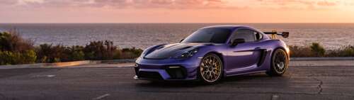 A sleek and powerful Porsche GT3 RS sports car featuring aggressive aerodynamic bodywork. Dual UHD free background images