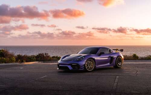 A sleek and powerful Porsche GT3 RS sports car featuring aggressive aerodynamic bodywork. 7680x4800 pictures for wallpaper