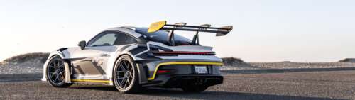 A sleek and powerful Porsche GT3 RS sports car featuring high-performance aerodynamic... Dual UHD wallpaper