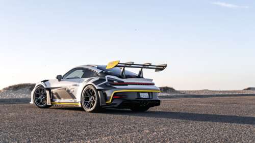 A sleek and powerful Porsche GT3 RS sports car featuring high-performance aerodynamic... 8K free wallpaper