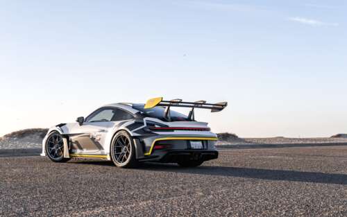 A sleek and powerful Porsche GT3 RS sports car featuring high-performance aerodynamic... 7680x4800 free desktop wallpaper