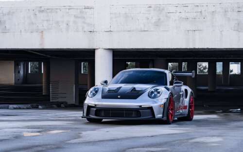 A sleek and powerful Porsche GT3 RS showcasing its aerodynamic contours and iconic... 7680x4800 computer backgrounds