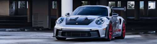 A sleek and powerful Porsche GT3 RS showcasing its aerodynamic contours and iconic... Dual UHD free hd wallpapers