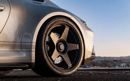 A high-performance Porsche GT3 RS sports car featuring aggressive aerodynamic styling. 7680x4800