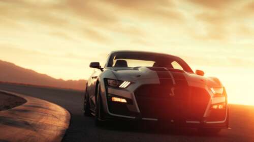 A sleek silver Ford Mustang Shelby GT500 muscle car parked. 8K hd background