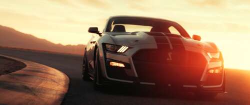 A sleek silver Ford Mustang Shelby GT500 muscle car parked. UWUHD wallpaper for laptop download