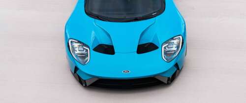 A high-performance Ford GT supercar featuring its aerodynamic body and iconic design. UWUHD wallpaper