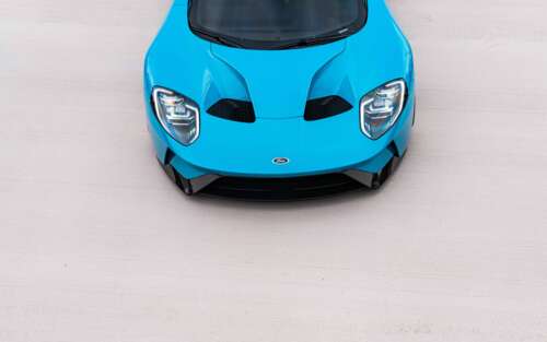 A high-performance Ford GT supercar featuring its aerodynamic body and iconic design. 7680x4800 wallpaper photo gallery download