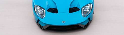 A high-performance Ford GT supercar featuring its aerodynamic body and iconic design. Dual UHD wallpaper for laptop download