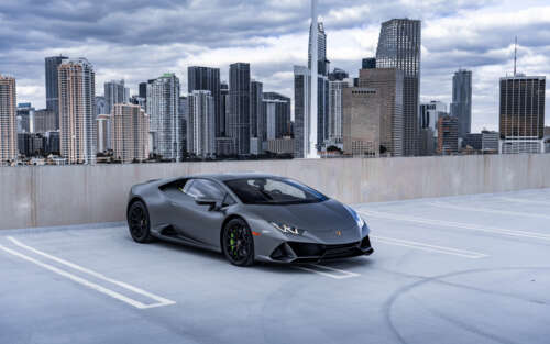 A close-up shot of a modern Lamborghini Huracán supercar in a dramatic setting. 7680x4800 wallpaper for pc download