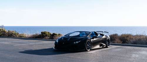 A high-performance Lamborghini Huracán supercar captured in a dynamic pose. UWUHD free background images