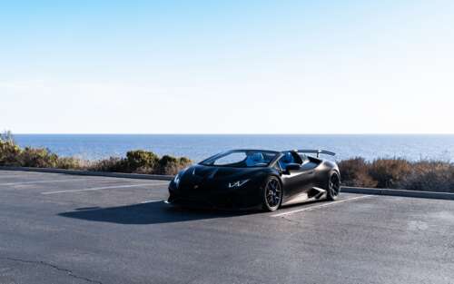 A high-performance Lamborghini Huracán supercar captured in a dynamic pose. 7680x4800