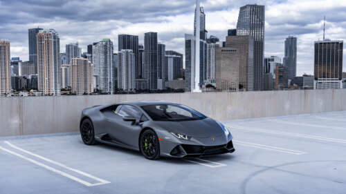 A close-up shot of a modern Lamborghini Huracán supercar in a dramatic setting. 4K (Ultra HD) free wallpaper