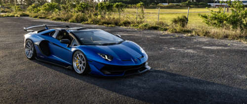 A high-performance Lamborghini supercar featuring iconic aerodynamic curves and a... UWUHD desktop wallpaper