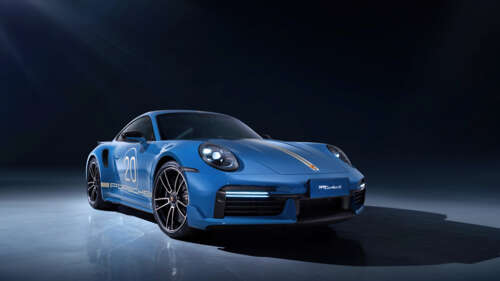 A detailed view of a sleek, high-performance Porsche 911 Turbo sports car featuring... 8K wallpaper photo gallery download