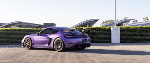 A high-performance Porsche GT3 RS sports car featuring aggressive aerodynamic styling. UWUHD high definition wallpaper