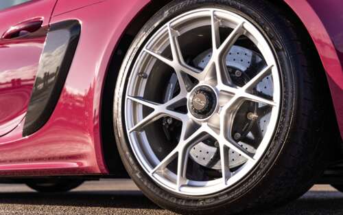 A sleek, high-performance Porsche sports car captured in a stunning light. 7680x4800 background images hd