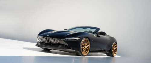 A sleek and polished Ferrari Roma luxury sports car highlighting its aerodynamic... UWUHD wallpaper for pc download
