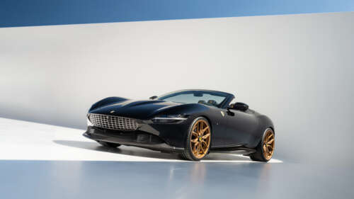 A sleek and polished Ferrari Roma luxury sports car highlighting its aerodynamic... 4K (Ultra HD) hd background