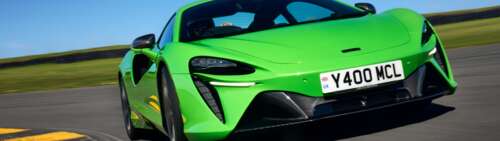 A bright green McLaren Artura luxury supercar featuring aerodynamic curves and a... Dual UHD pictures for wallpaper