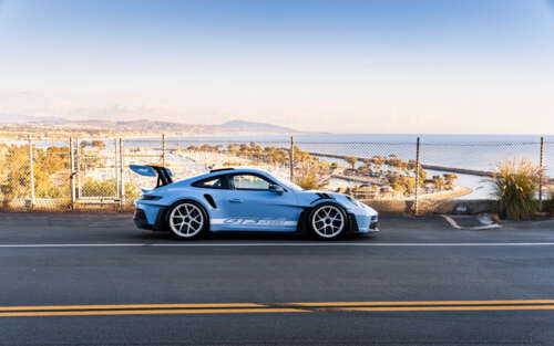 A sleek and polished Porsche sports car featuring modern aerodynamic design. 7680x4800 background images hd