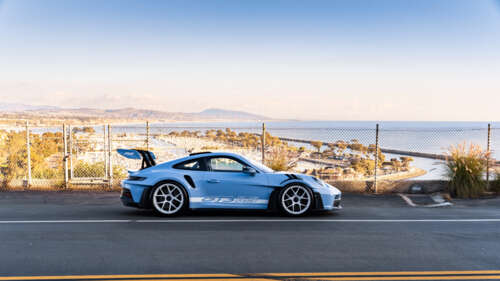 A sleek and polished Porsche sports car featuring modern aerodynamic design. 4K (Ultra HD) wallpaper for laptop download