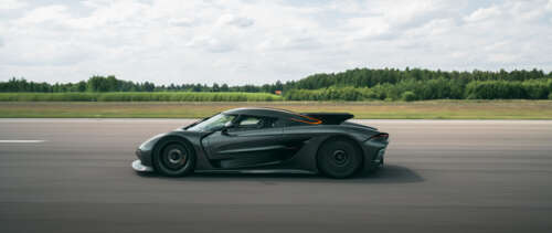 A sleek and aerodynamic Koenigsegg Jesko Absolut hypercar presented in a high-detail... UWUHD