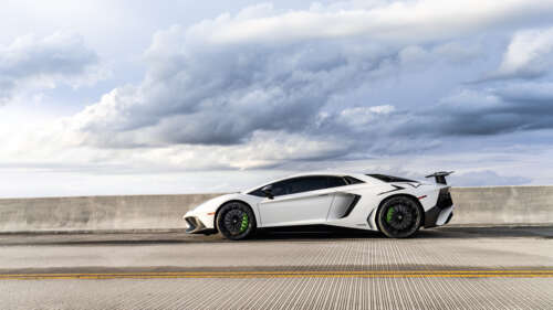 A sleek and powerful Lamborghini supercar featuring sharp lines and a high-gloss... 8K desktop wallpaper