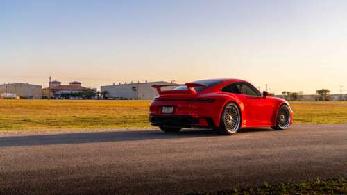 A high-resolution, close-up shot of a sleek Porsche 992 GTS sports car featuring... 8K free background images