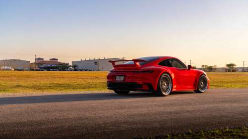 A high-resolution, close-up shot of a sleek Porsche 992 GTS sports car featuring... 4K (Ultra HD) desktop wallpaper