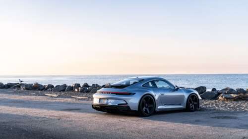 A high-performance Porsche GT3 RS sports car featuring aerodynamic styling. 8K hd background